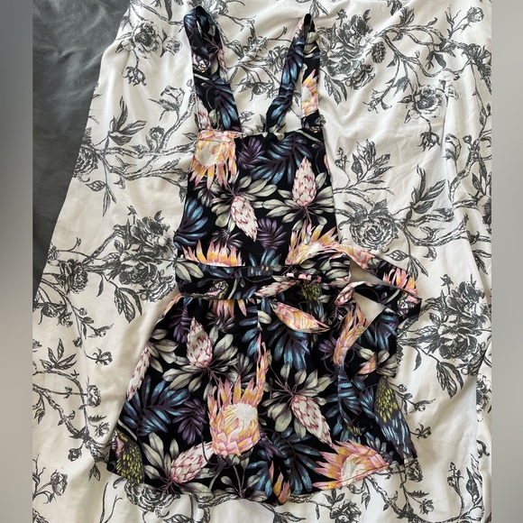 Pants - Cute tropical print romper/overalls. Ties at the waist & criss cross open back